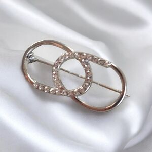 Elegant Silver and Pink Interlocking Circle Brooch